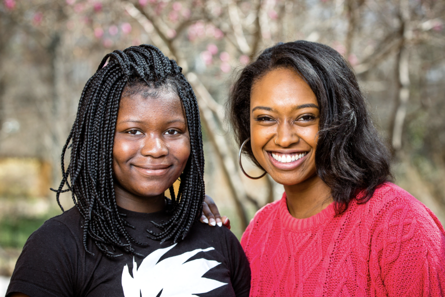 Mentee and mentor smiling together